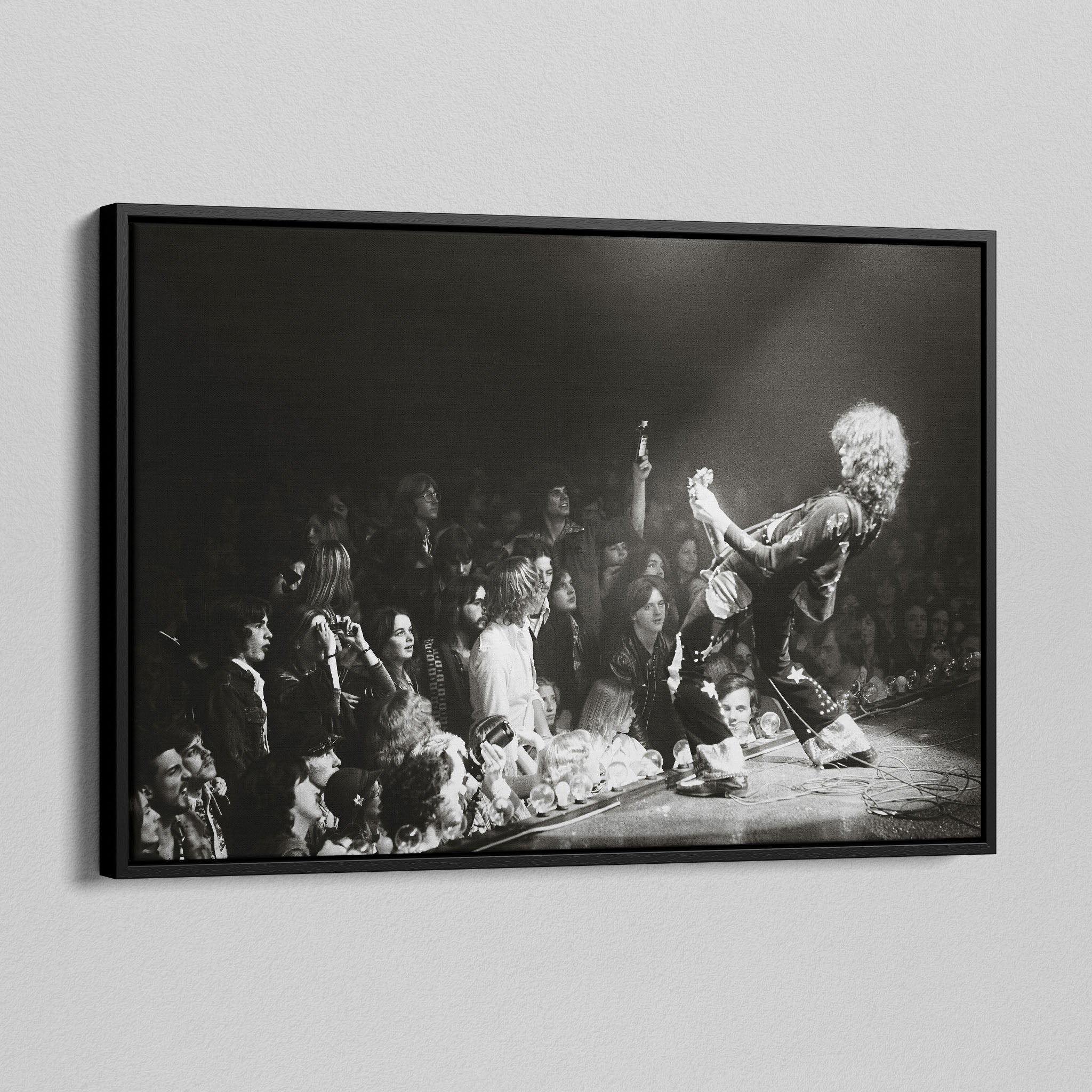 Angled view of the Jimmy Page black and white canvas in a black floating frame