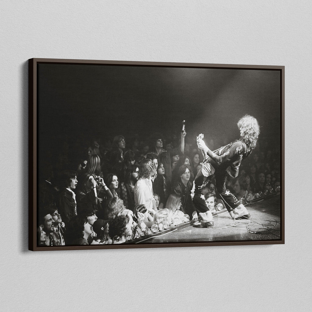 Angled view of the Jimmy Page black and white canvas in a dark walnut floating frame