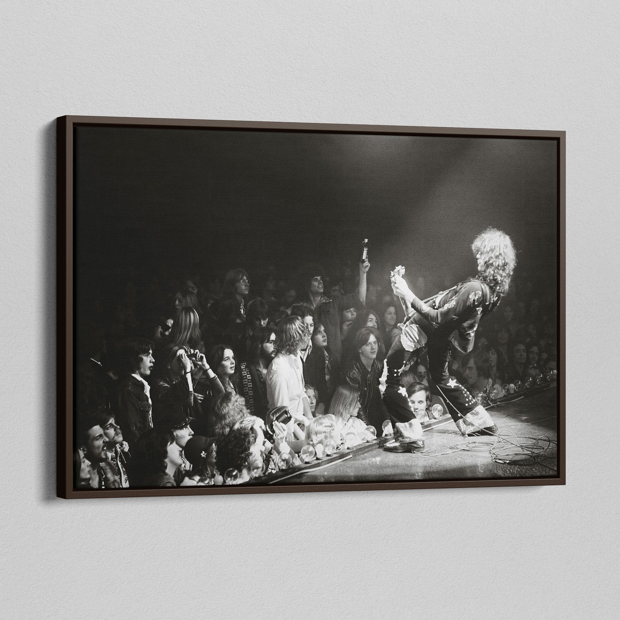 Angled view of the Jimmy Page black and white canvas in a dark walnut floating frame