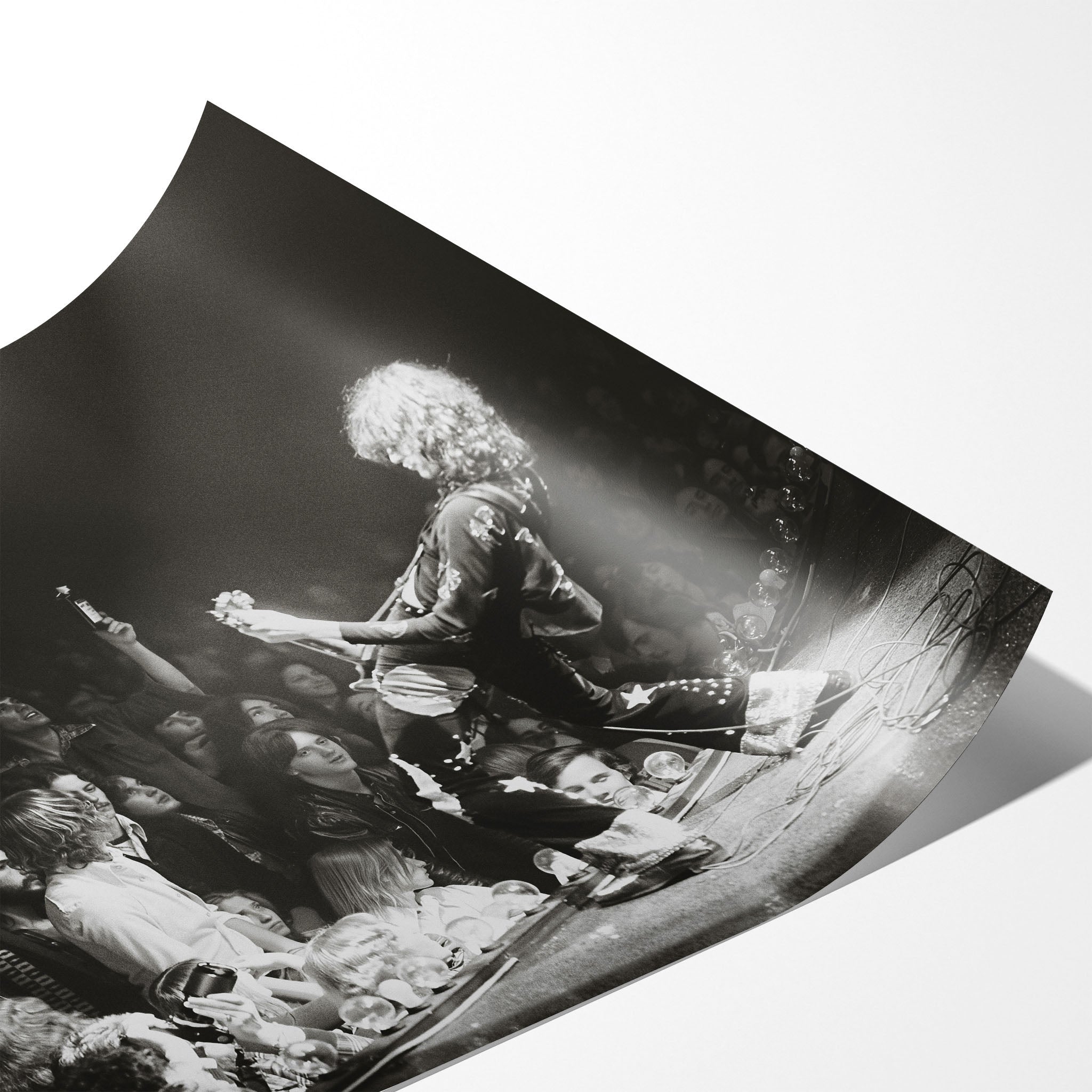 Angled close-up of the unframed Jimmy Page black and white poster showing fine paper detail