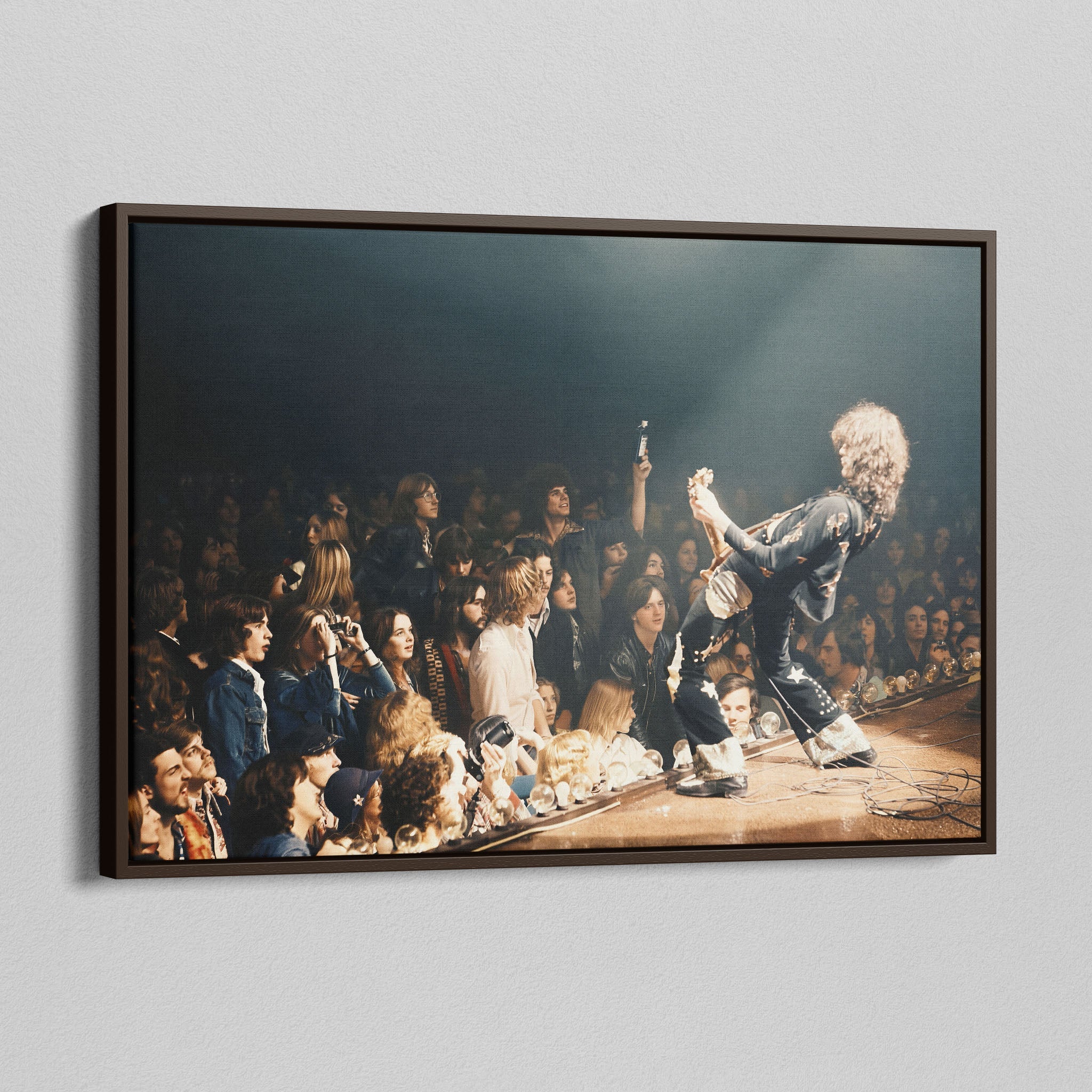 Angled view of the Jimmy Page colorized canvas in a dark walnut floating frame