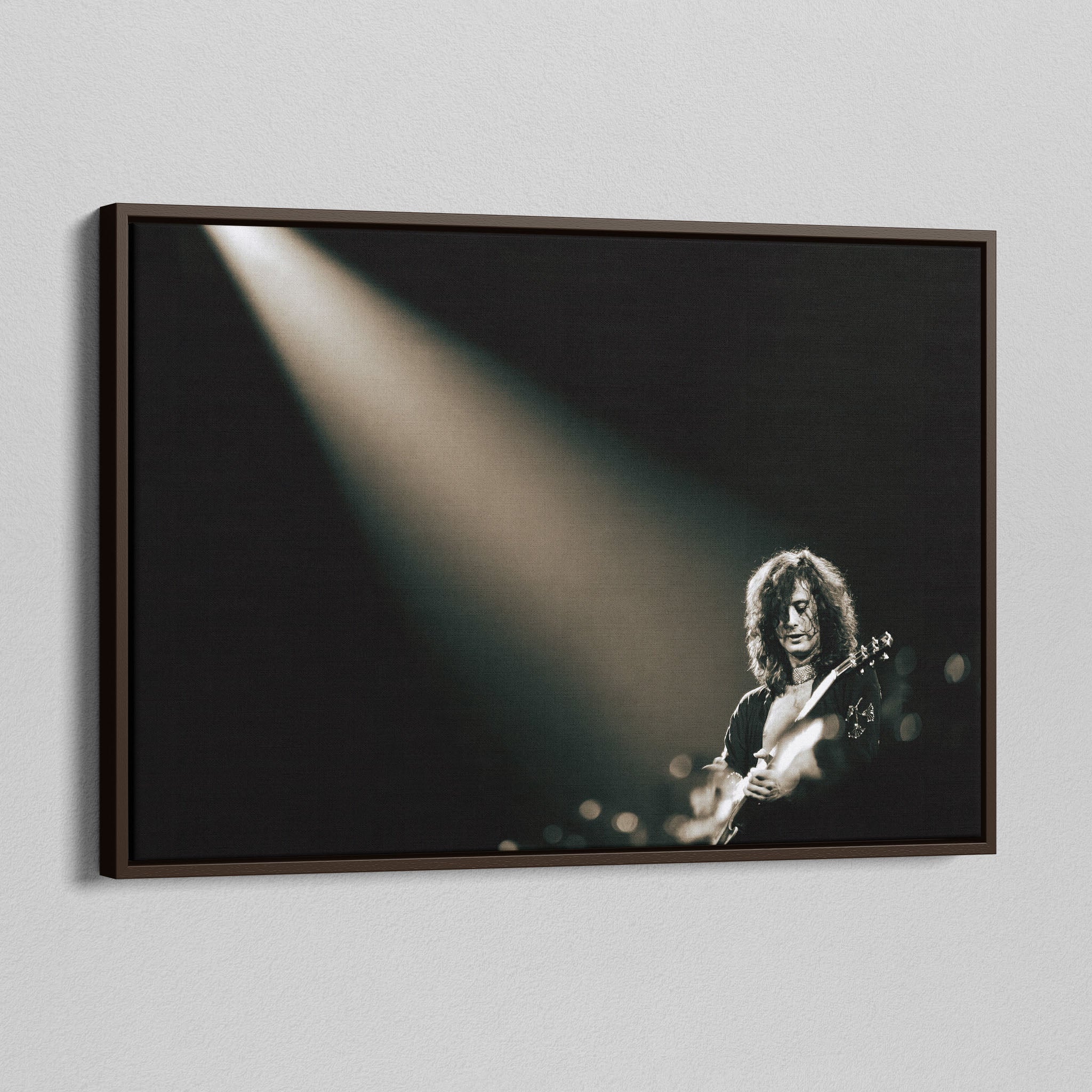 Angled view of the Jimmy Page canvas in a dark walnut floating frame
