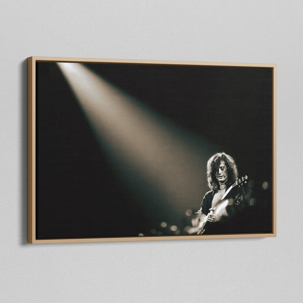 Angled view of the Jimmy Page canvas in a natural oak floating frame