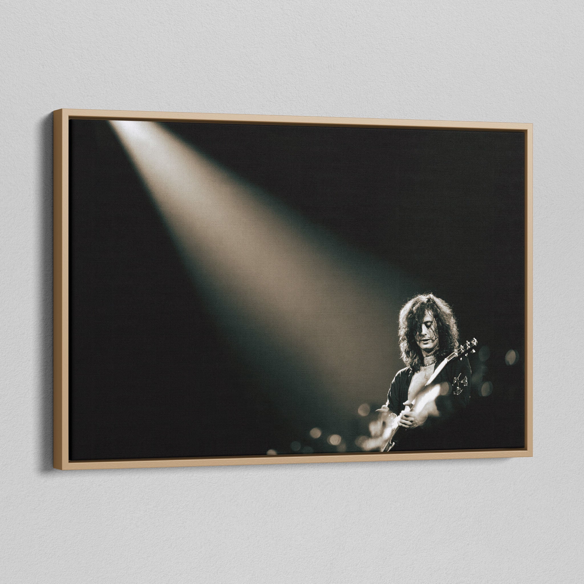 Angled view of the Jimmy Page canvas in a natural oak floating frame