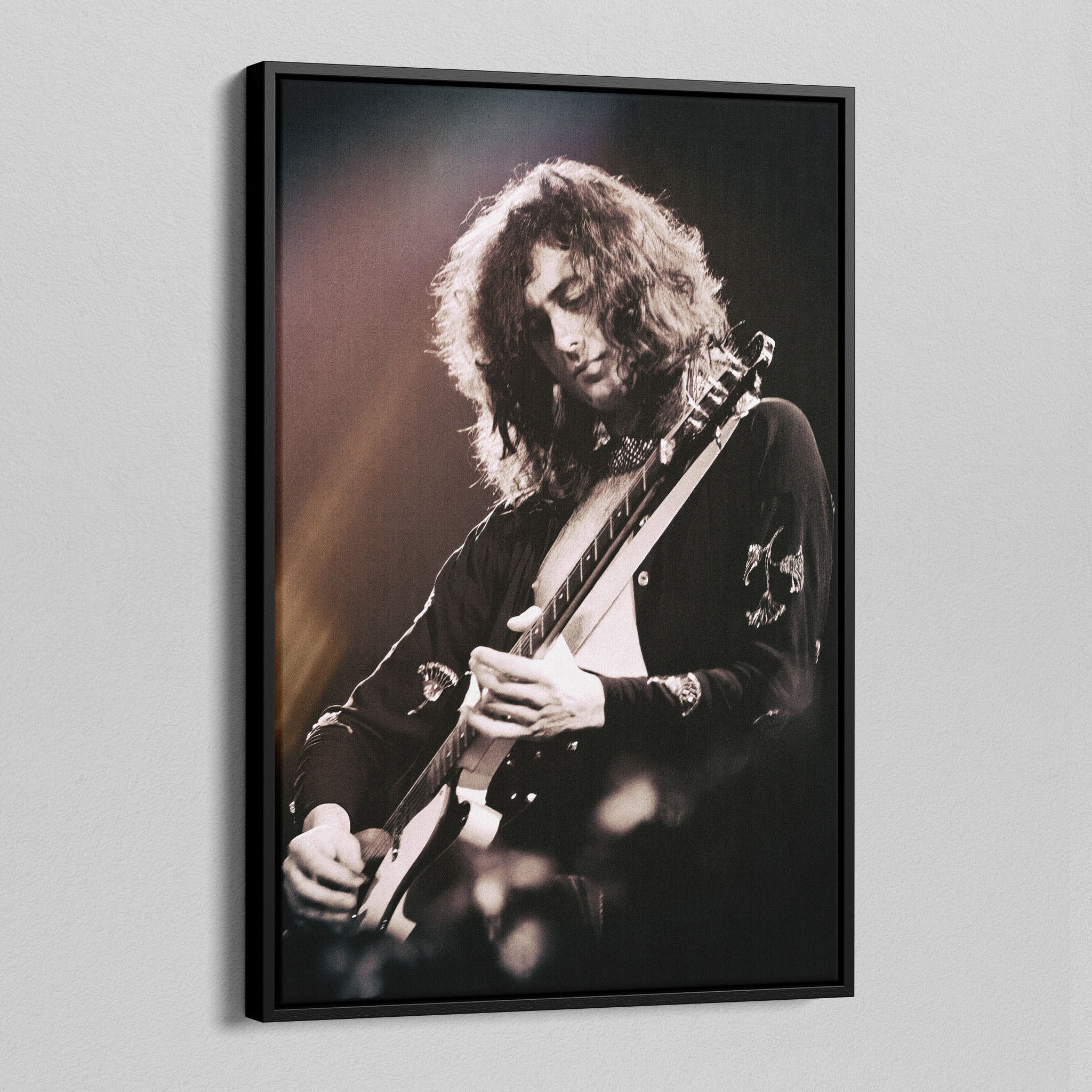 Angled view of the Jimmy Page canvas in a black floating frame