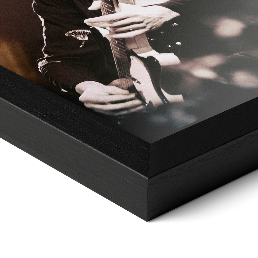 Close-up of the Jimmy Page poster in a classic black wood frame