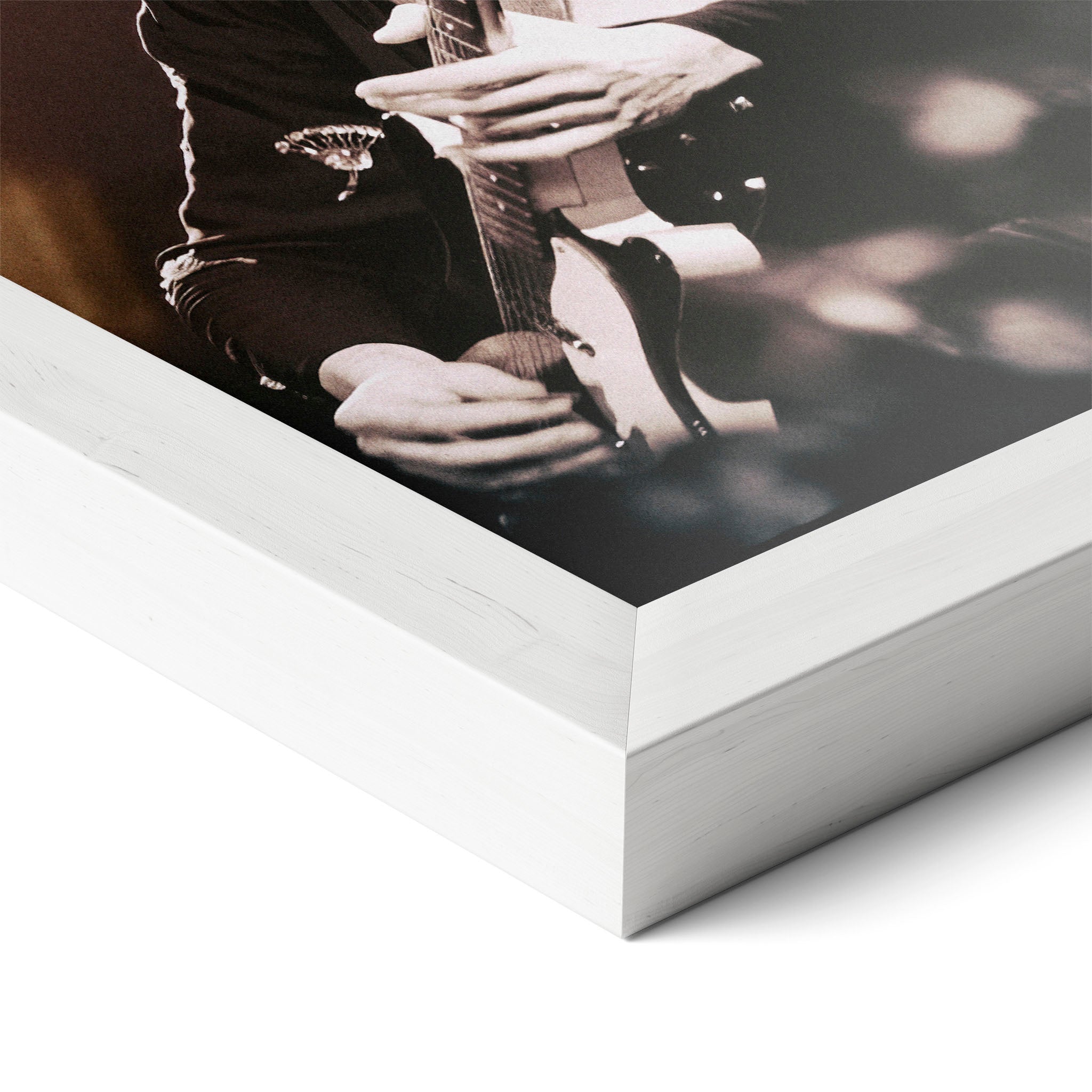 Corner close-up of the Jimmy Page poster in a white frame