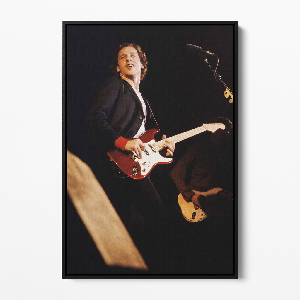 Front display of the Mark Knopfler color canvas in a black floating frame
