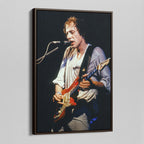 Angled view of the Mark Knopfler color canvas in a dark walnut floating frame