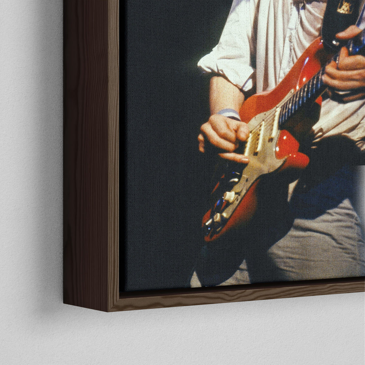 Close-up of the dark walnut floating frame on the Mark Knopfler color canvas