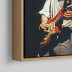 Corner close-up of the natural oak floating frame on the Mark Knopfler color canvas