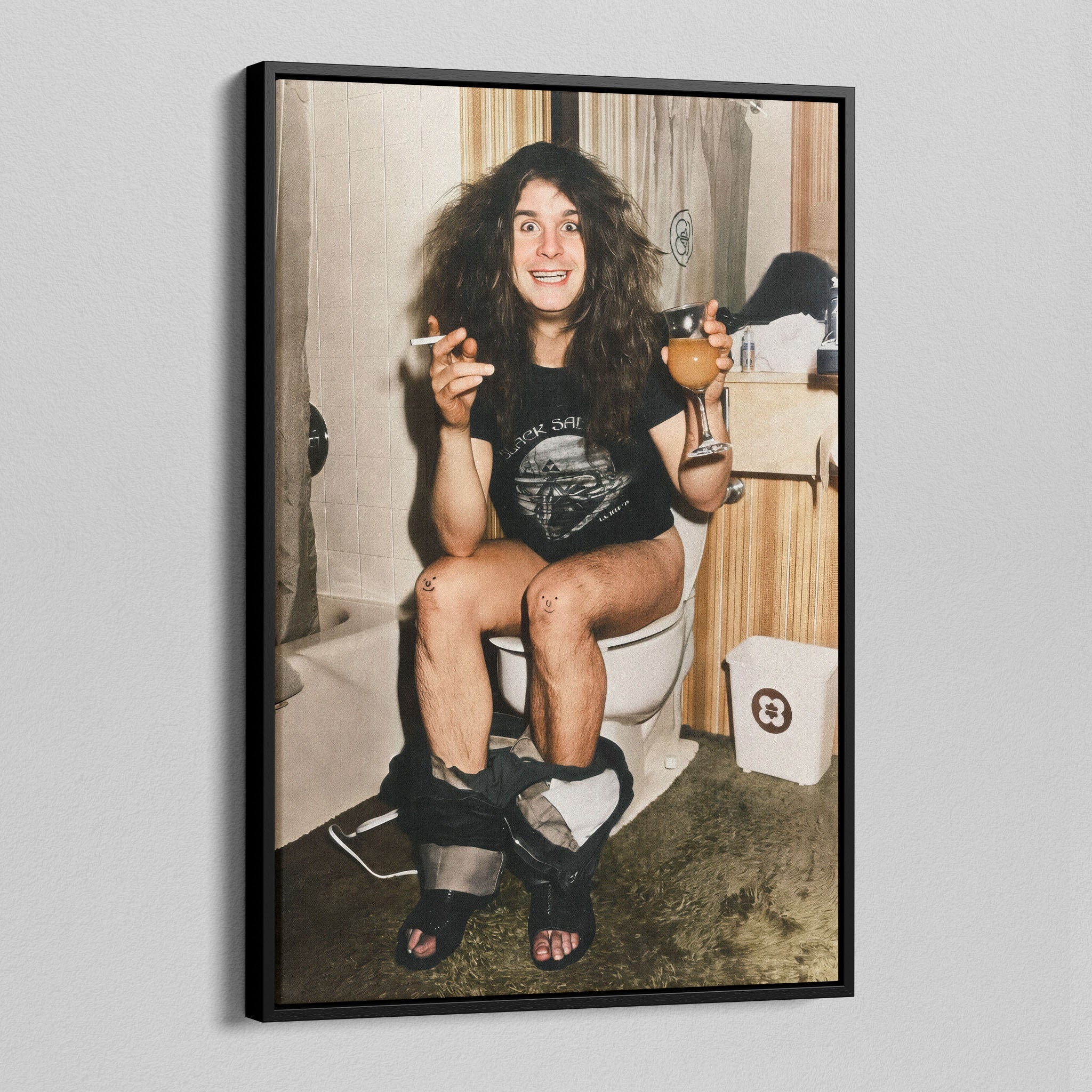 Angled view of the Ozzy Osbourne bathroom colour canvas in a black floating frame