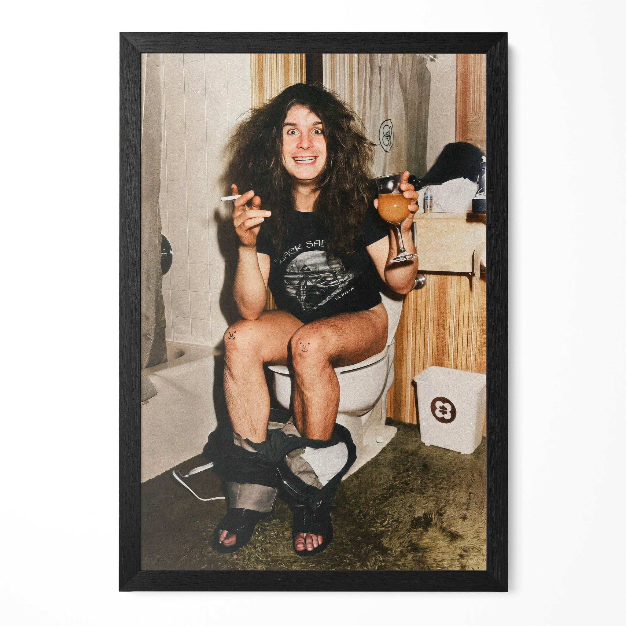 Funny colour photo of Ozzy Osbourne on the toilet in 1978, in a classic black poster frame
