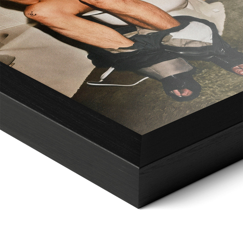 Close-up of the Ozzy Osbourne bathroom colour poster in a classic black wood frame