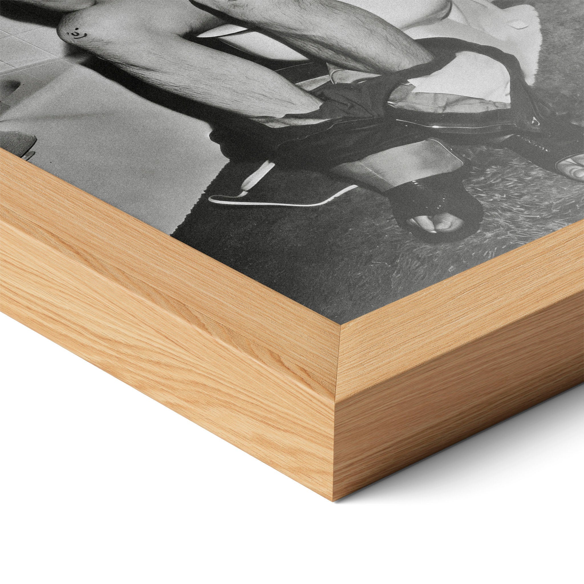 Close-up of the natural oak frame on the Ozzy Osbourne bathroom black and white poster