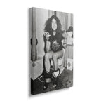 Gallery-wrapped black and white canvas of Ozzy Osbourne on the toilet displayed on a wall