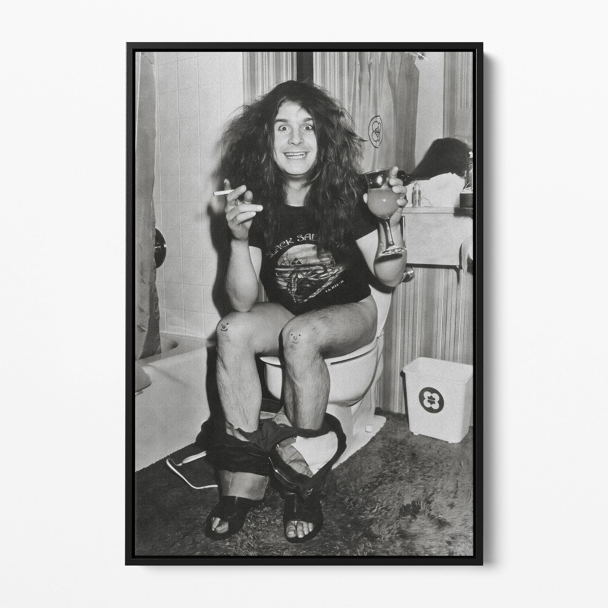 Front display of the Ozzy Osbourne bathroom black and white canvas in a black floating frame