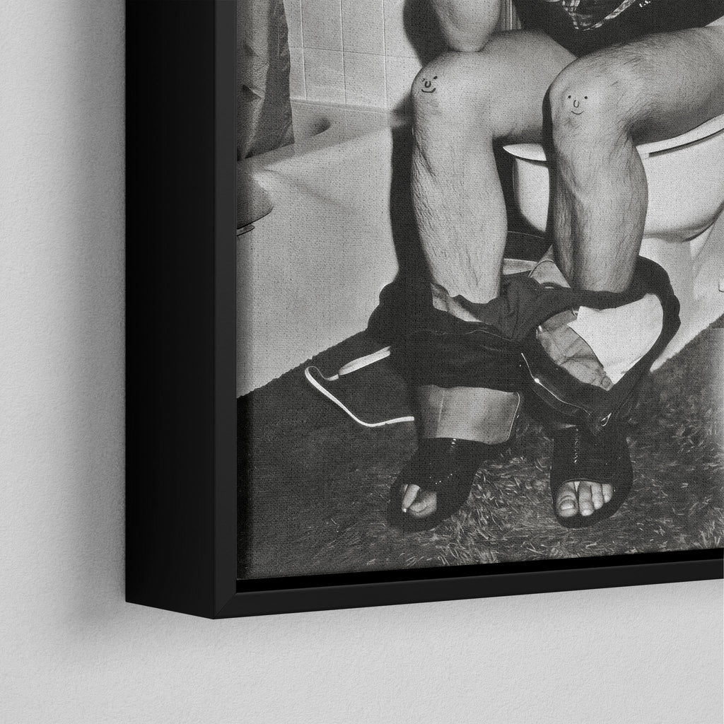 Corner close-up of the black floating frame on the Ozzy Osbourne bathroom black and white canvas