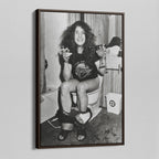 Angled view of the Ozzy Osbourne bathroom black and white canvas in a dark walnut floating frame