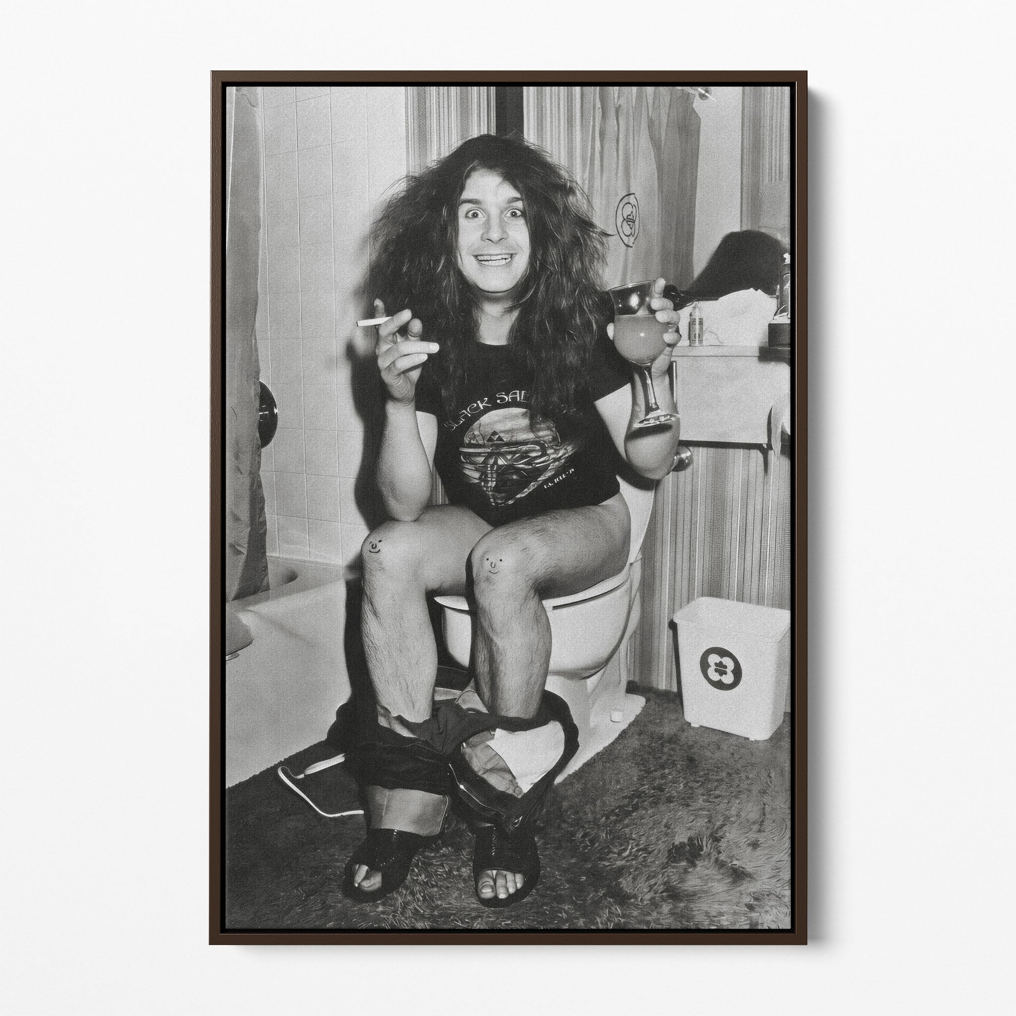 Front display of the Ozzy Osbourne bathroom black and white canvas in a dark walnut floating frame