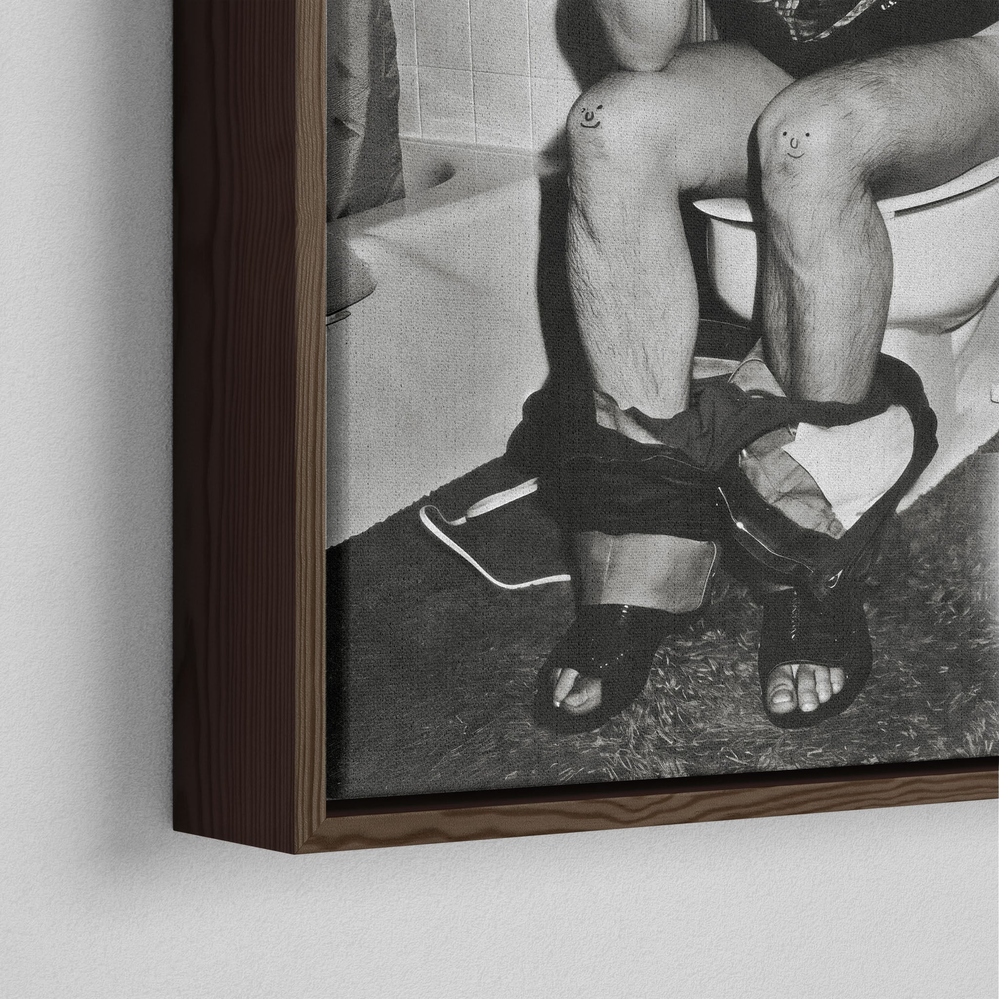 Close-up of the dark walnut floating frame on the Ozzy Osbourne bathroom black and white canvas