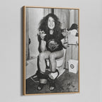 Angled view of the Ozzy Osbourne bathroom black and white canvas in a natural oak floating frame