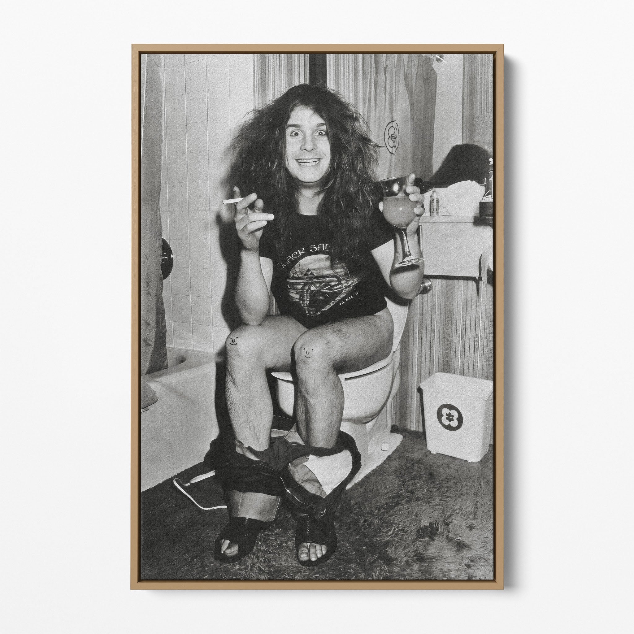 Front display of the Ozzy Osbourne bathroom black and white canvas in a natural oak floating frame