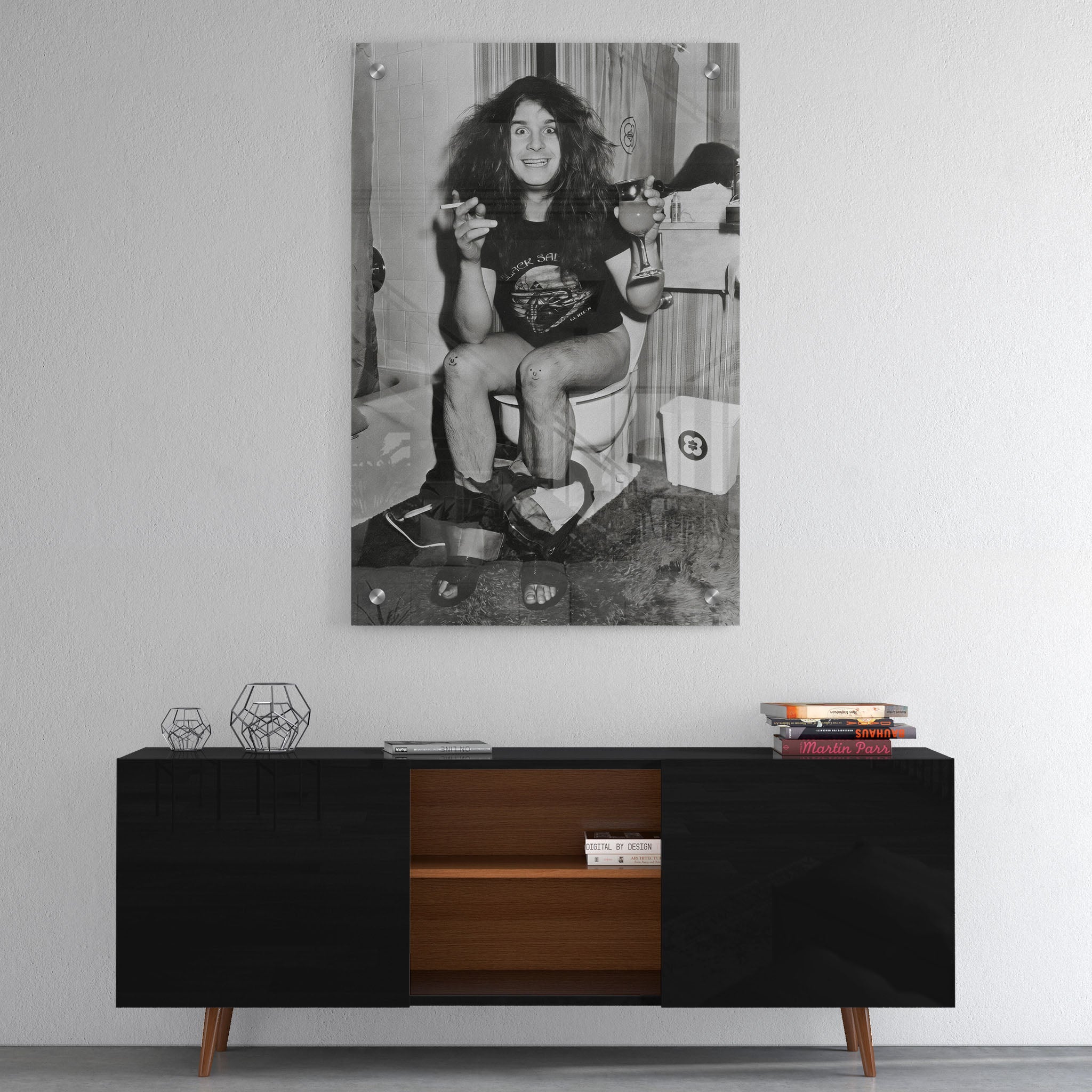 High-gloss acrylic black and white print of Ozzy Osbourne on the toilet displayed on a wall
