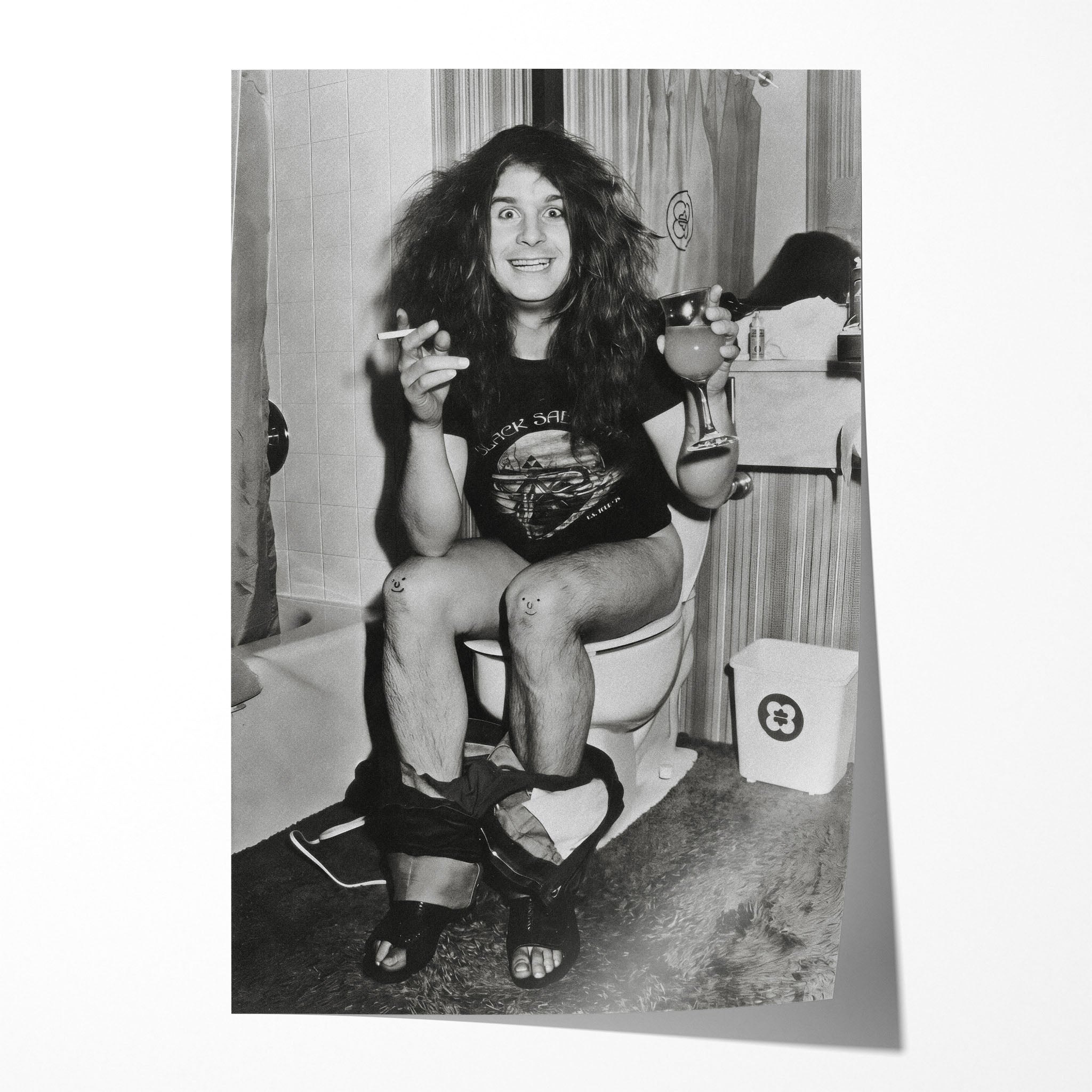 Unframed black and white print of Ozzy Osbourne sitting on the toilet in his 1978 Black Sabbath tour shirt
