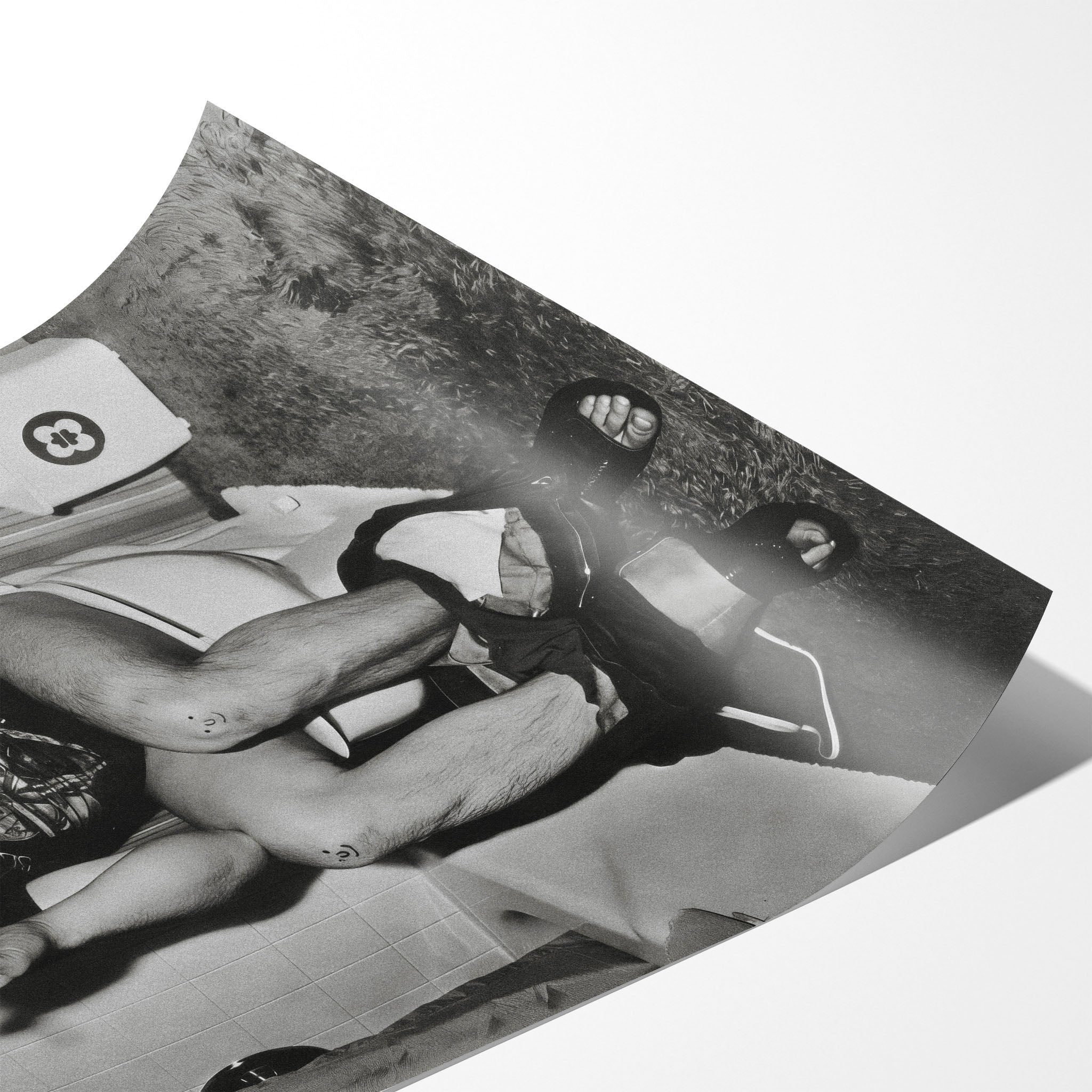 Angled close-up of the unframed Ozzy Osbourne bathroom black and white poster showing fine paper detail