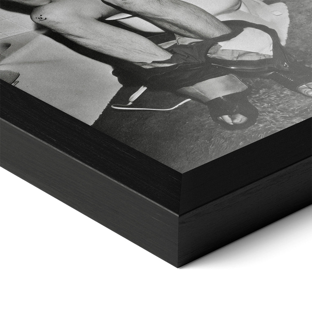 Close-up of the Ozzy Osbourne bathroom black and white poster in a classic black wood frame