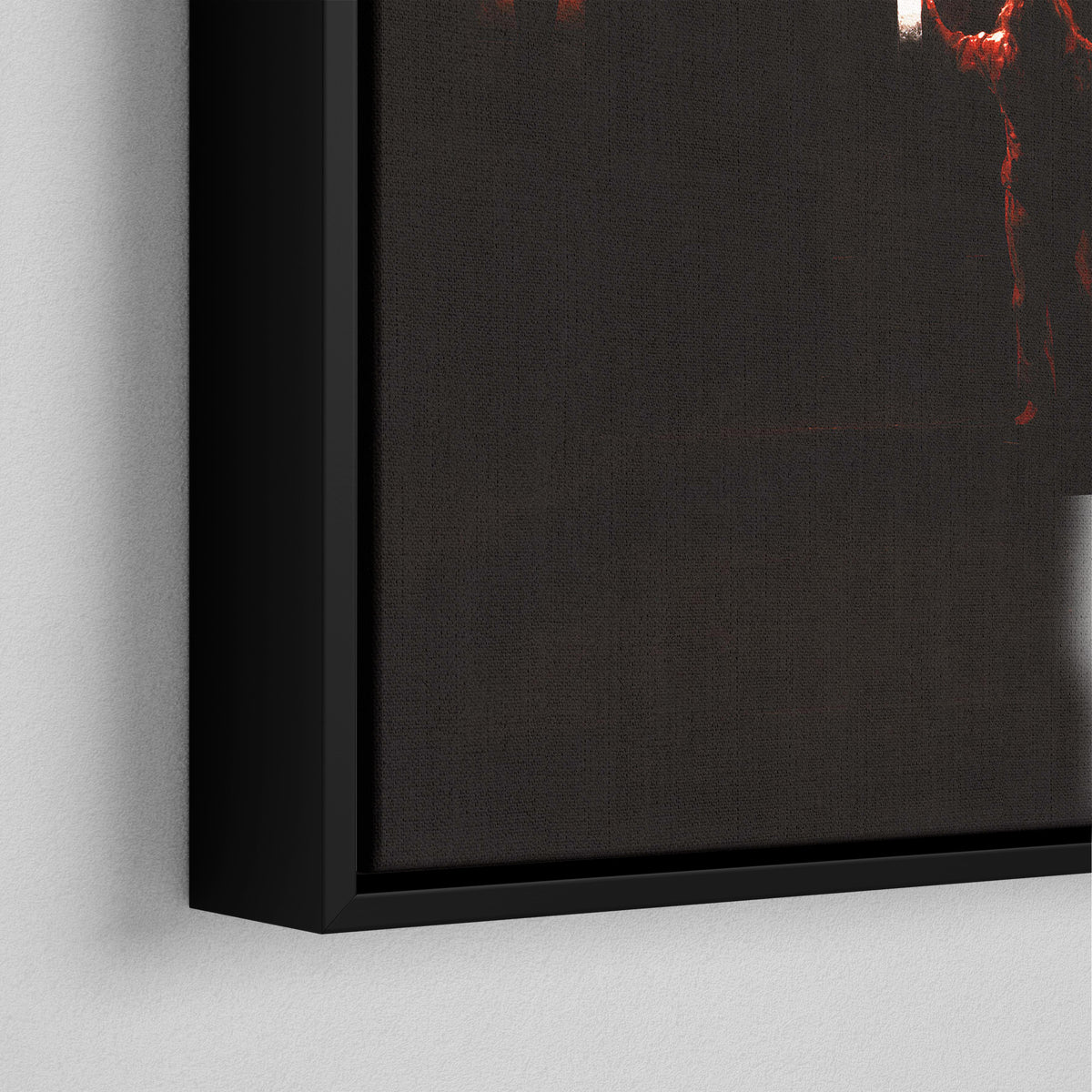 Corner close-up of the black floating frame on the Ozzy Osbourne color canvas