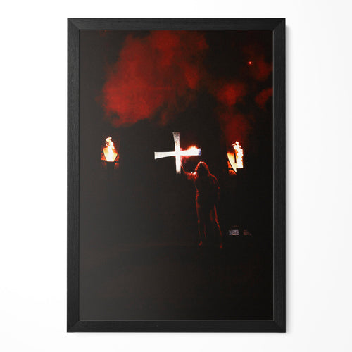 Ozzy Osbourne raising a glowing cross on stage, 1981-82 tour, color print in a classic black poster frame