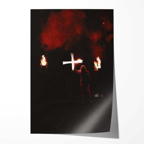 Unframed color print of Ozzy Osbourne raising a white cross between flaming torches and red smoke