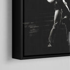 Corner close-up of the black floating frame on the Ozzy and Randy Rhoads black and white canvas