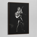 Angled view of the Ozzy and Randy Rhoads black and white canvas in a dark walnut floating frame