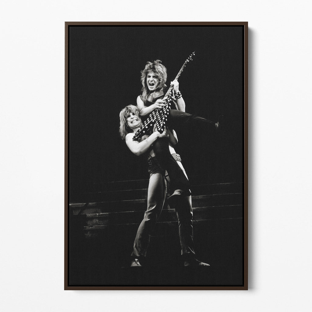 Front display of the Ozzy and Randy Rhoads black and white canvas in a dark walnut floating frame