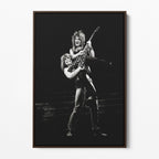 Front display of the Ozzy and Randy Rhoads black and white canvas in a dark walnut floating frame