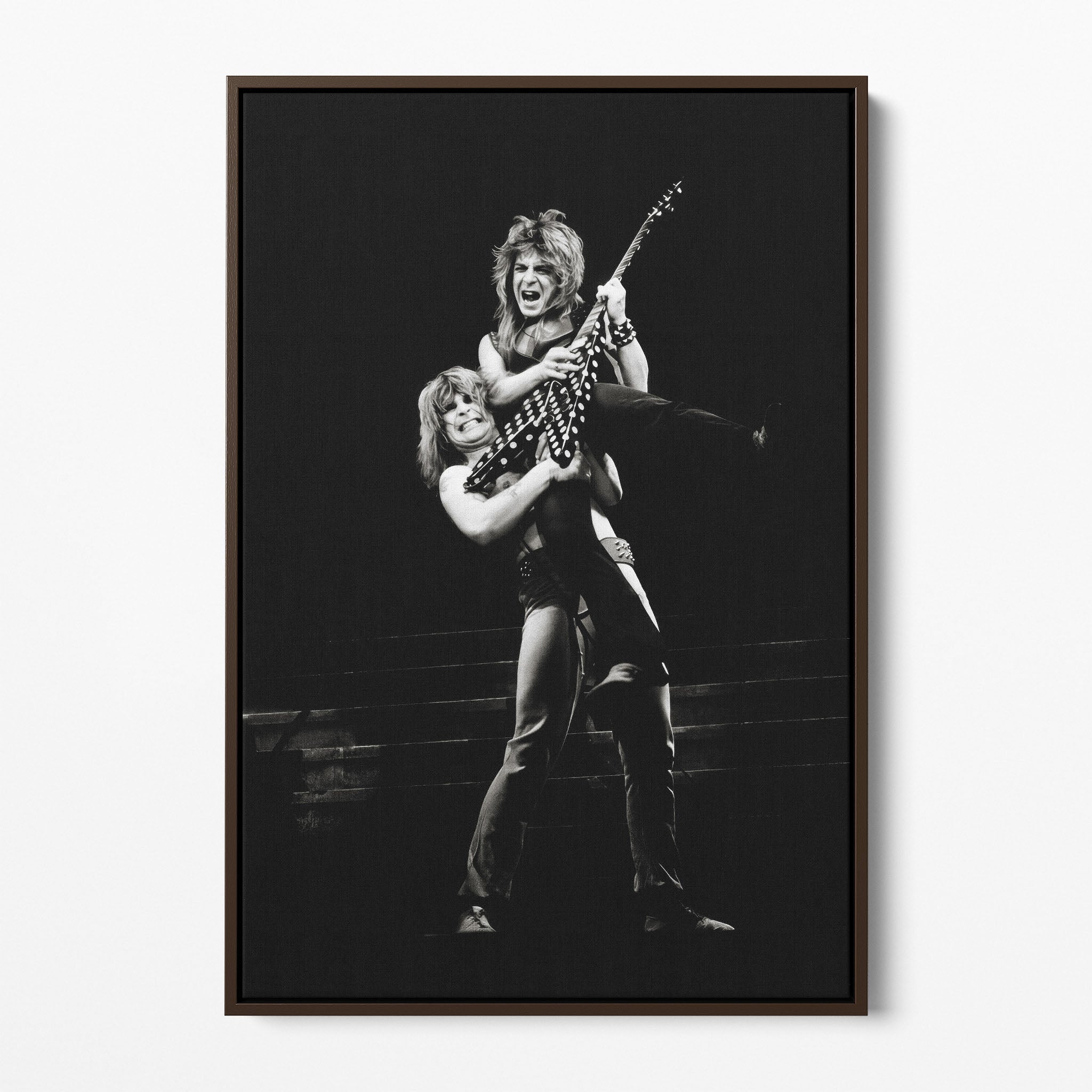 Front display of the Ozzy and Randy Rhoads black and white canvas in a dark walnut floating frame