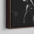 Close-up of the dark walnut floating frame on the Ozzy and Randy Rhoads black and white canvas