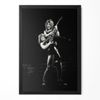 Ozzy Osbourne lifting Randy Rhoads on stage in 1982, black and white portrait in a classic black poster frame