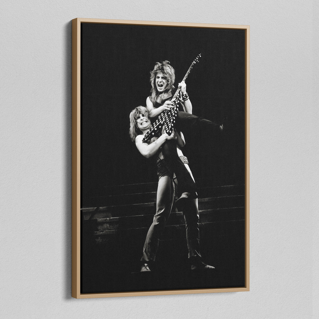 Angled view of the Ozzy and Randy Rhoads black and white canvas in a natural oak floating frame