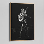 Angled view of the Ozzy and Randy Rhoads black and white canvas in a natural oak floating frame