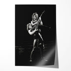 Unframed black and white print of Ozzy Osbourne lifting Randy Rhoads with his polka-dot Flying V, 1982