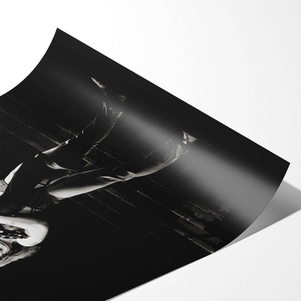 Angled close-up of the unframed Ozzy and Randy Rhoads black and white poster showing fine paper detail