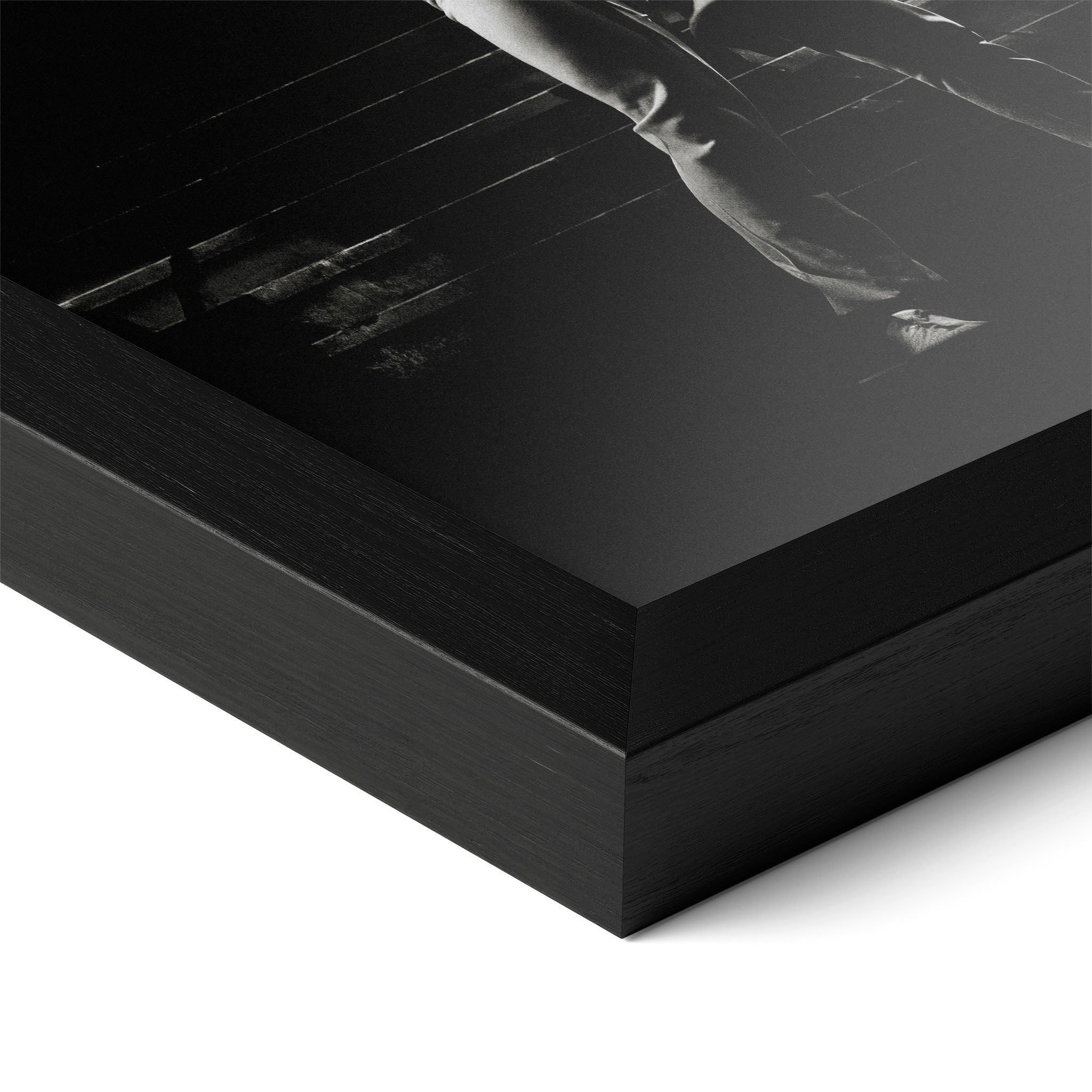 Close-up of the Ozzy and Randy Rhoads black and white poster in a classic black wood frame