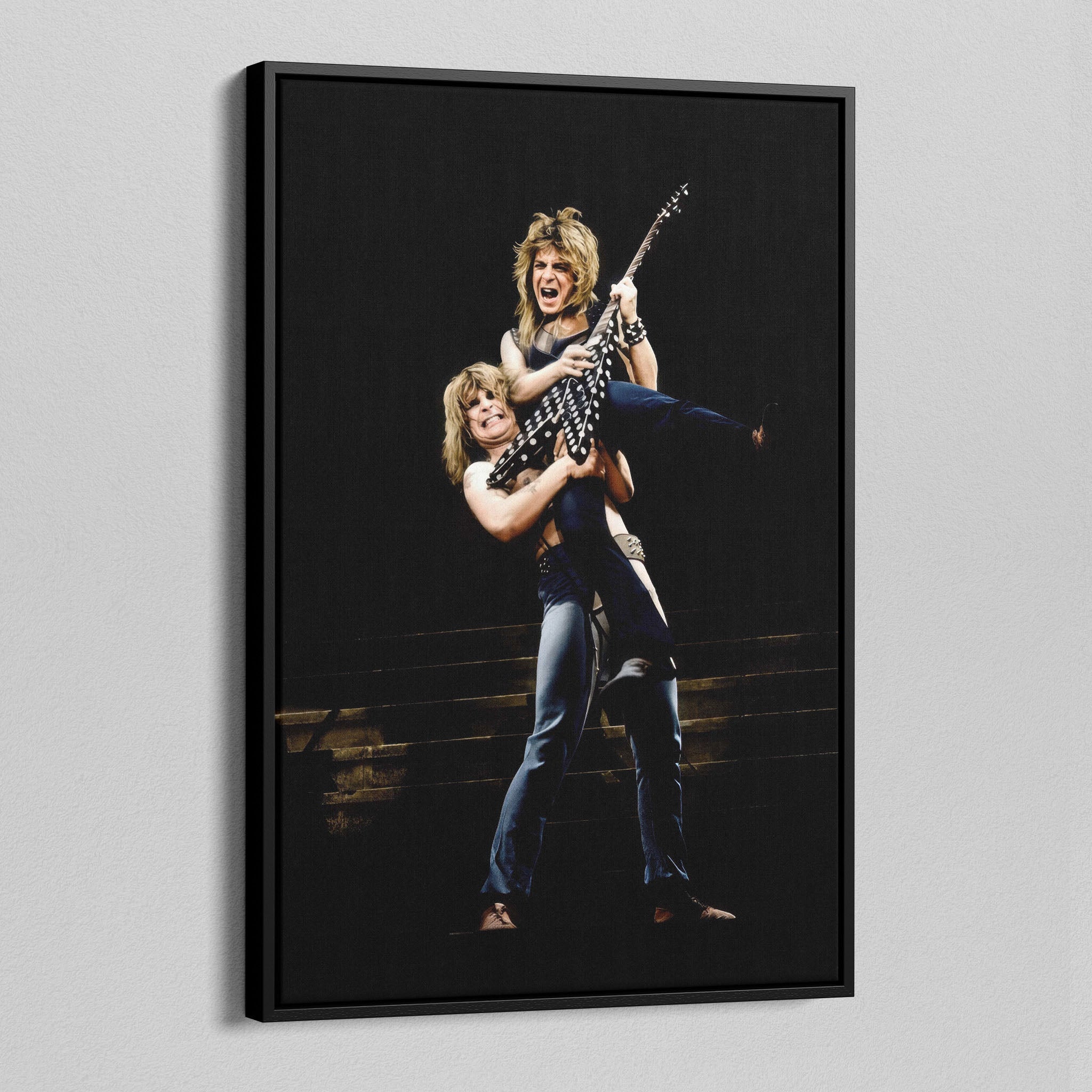 Angled view of the Ozzy and Randy Rhoads colour canvas in a black floating frame