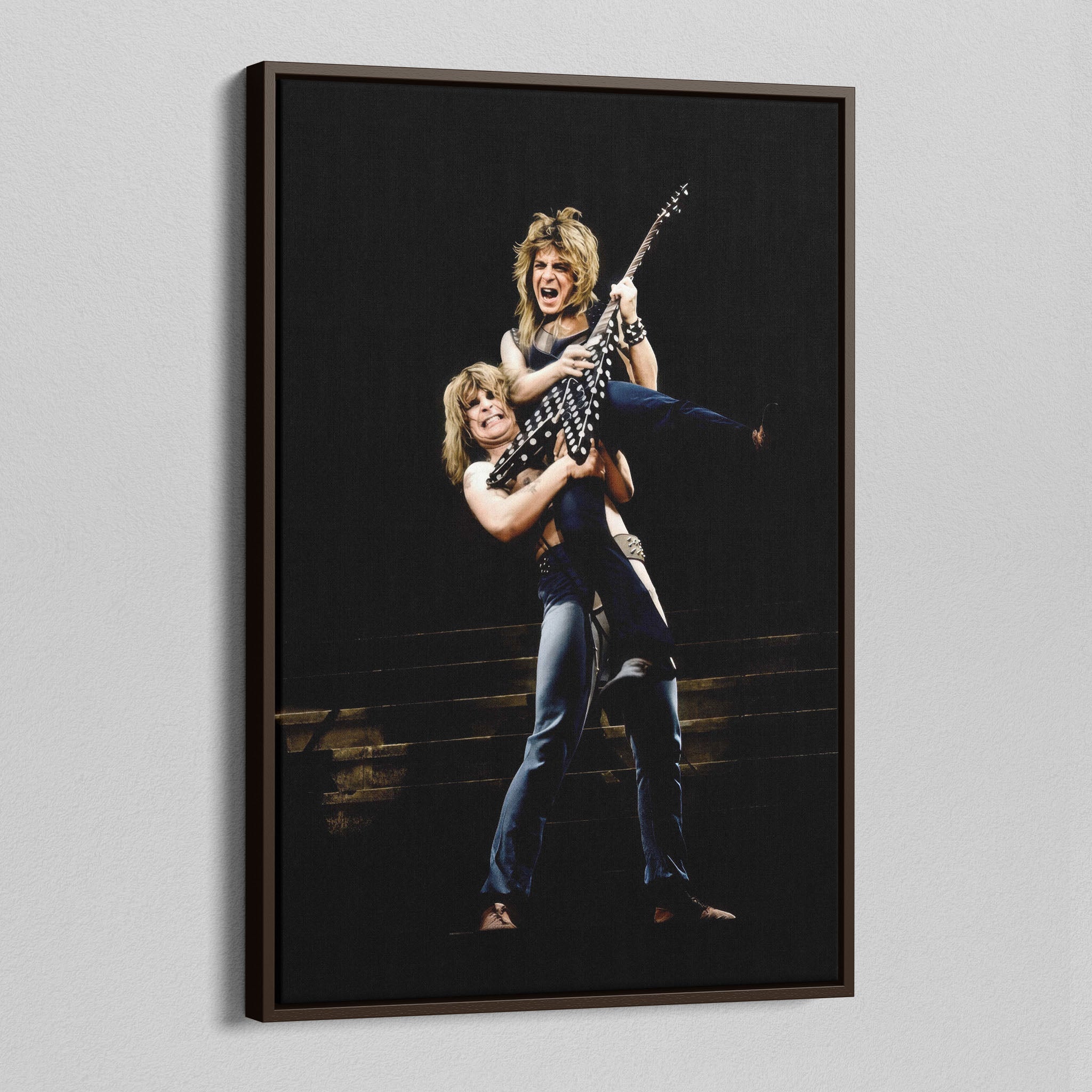 Angled view of the Ozzy and Randy Rhoads colour canvas in a dark walnut floating frame