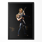 Ozzy Osbourne lifting Randy Rhoads on stage in 1982, colour portrait in a classic black poster frame