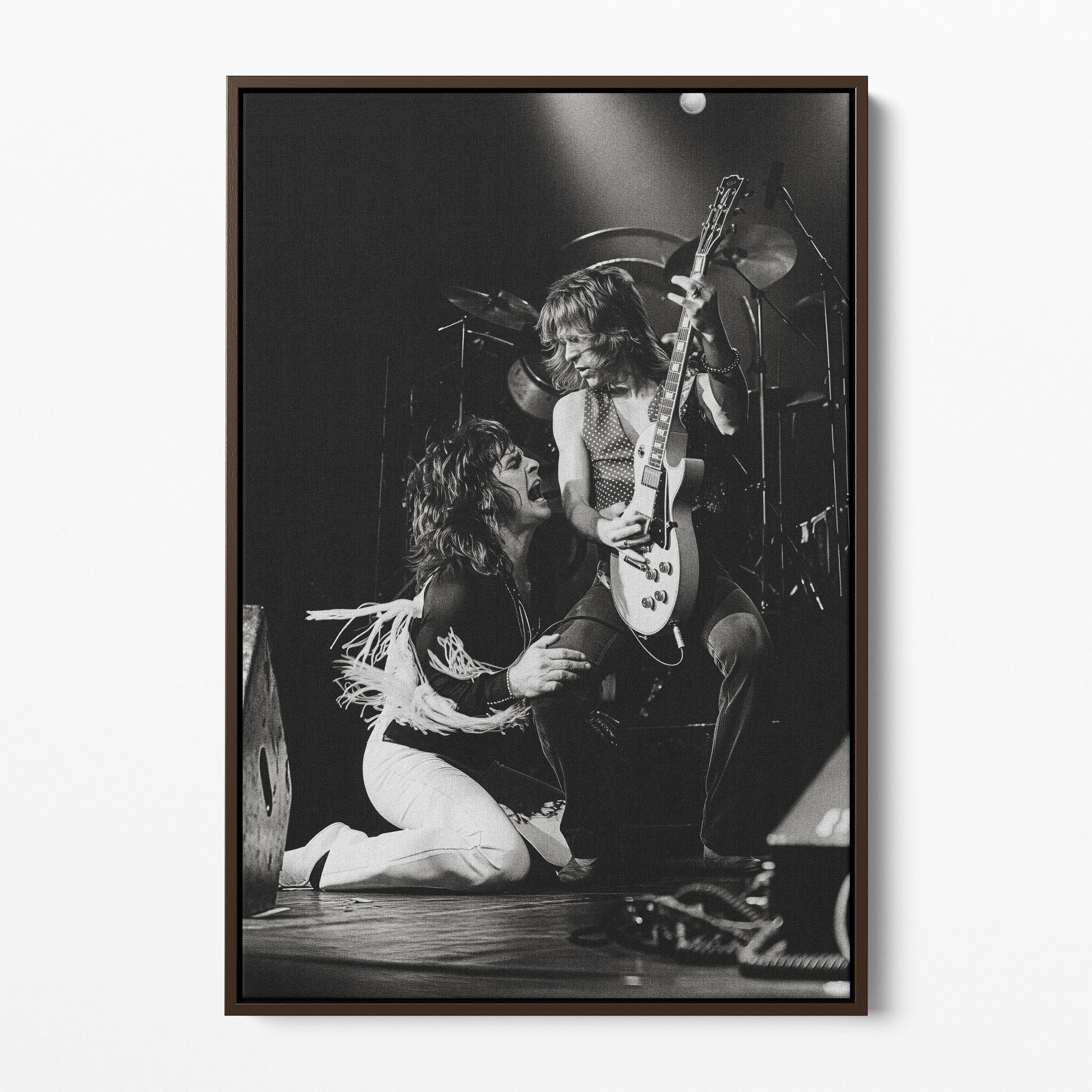 Front display of the Ozzy and Randy Rhoads black and white canvas in a dark walnut floating frame